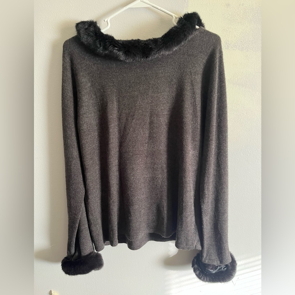 Black vintage sweater with removable faux fur trim.  Medium